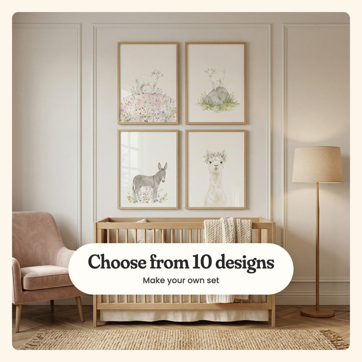 Nursery with four baby farm animal prints in light wood frames in two rows on a cream panelled wall above a light wood crib with a knit throw, beside a blush armchair and a linen floor lamp: a lamb on a flowery hill, a goat on a rock, a donkey in wildflowers and an alpaca in a flower crown, labeled Choose from 10 designs, Make your own set