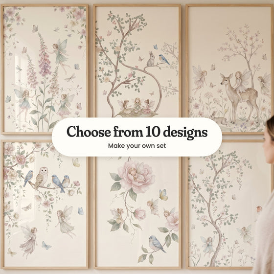 Six fairy prints in light wood frames in two rows, with a woman standing at the right: fairies among pink foxgloves, three fairies having tea on a big leaf, a fairy riding a spotted deer, an owl and bluebirds on a blossom branch, a fairy asleep in a pink peony and a robin by a blossom tree, with a label reading Choose from 10 designs, Make your own set