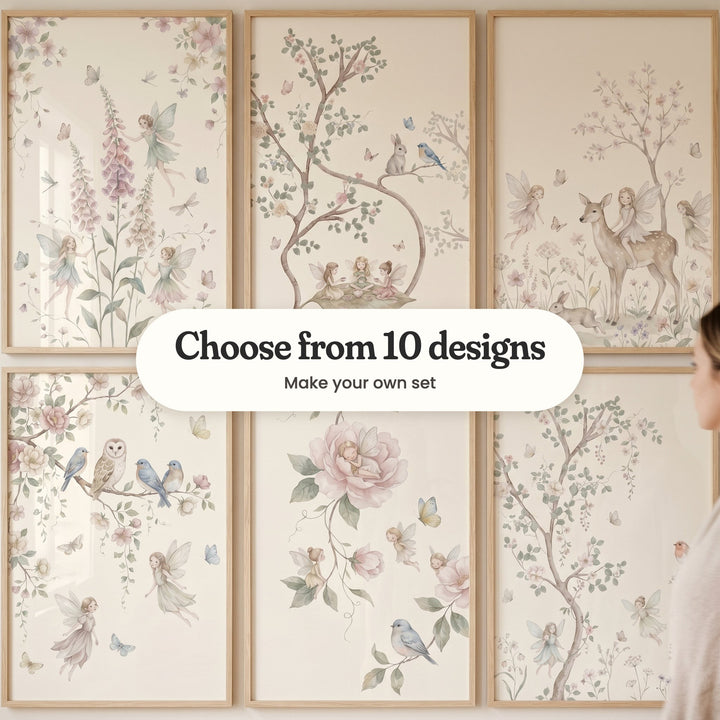 Six fairy prints in light wood frames in two rows, with a woman standing at the right: fairies among pink foxgloves, three fairies having tea on a big leaf, a fairy riding a spotted deer, an owl and bluebirds on a blossom branch, a fairy asleep in a pink peony and a robin by a blossom tree, with a label reading Choose from 10 designs, Make your own set