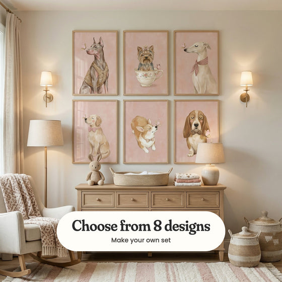 Cream nursery with six dog prints in light wood frames in two rows above a light wood dresser with a basket, folded blankets, a plush bunny and a lamp, between two brass wall lamps, beside a rocking chair with a knit throw and woven baskets: Gentle Doberman Soul, Floral Teacup Yorkie, Gentle Butterfly Kiss, Golden Butterfly Kiss, Sweet Butterfly Kiss and Gentle Dapper Hound, with a label reading Choose from 8 designs, Make your own set