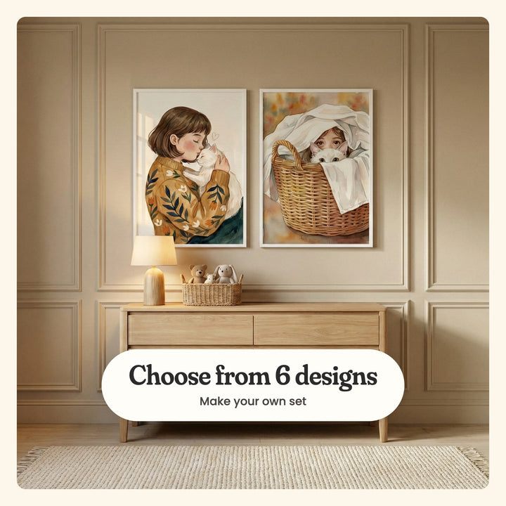 Beige panelled room with two girl and cat prints in white frames above a light wood dresser with a glowing lamp and a basket of plush toys: Cozy Cat Hug and Laundry Day Friends, labeled Choose from 6 designs, Make your own set