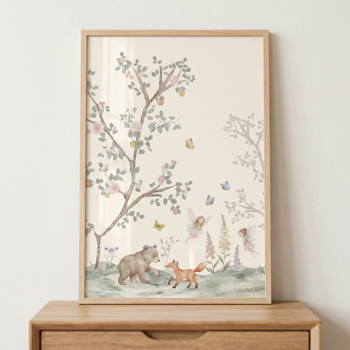 Watercolor walking bear and fox wall art with fairies and trees in a wood frame resting on a wooden dresser.