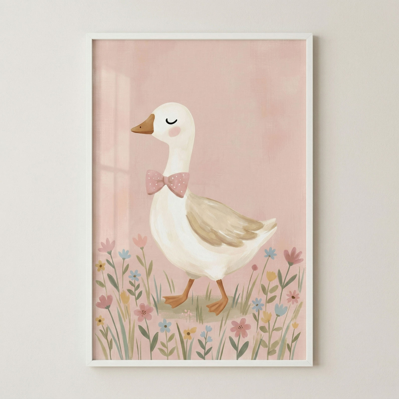 This framed piece of wall art features a charming illustration of a white goose. The goose, adorned with a pink polka-dot bow tie and a soft pink blush on its cheek, has its eyes peacefully closed. Its body is accented with light brown feathers on its wing, and it stands on orange webed feet. The bird is shown strolling through a meadow of delicate flowers in pastel shades of pink, blue, and yellow. The background is a soft, textured pink, all contained within a simple white frame.