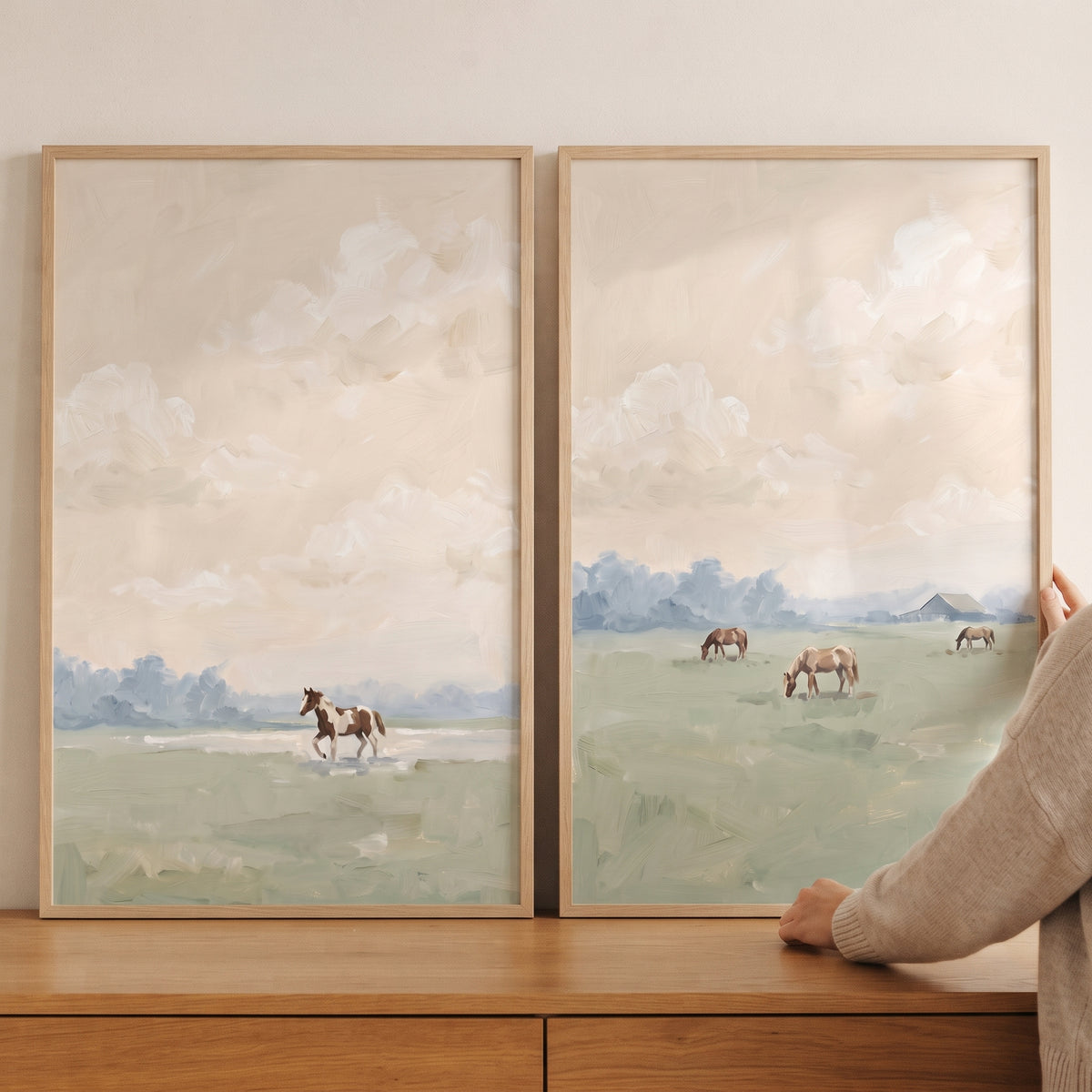 Warm apricot field horses artwork set of 2 featuring horses in a soft, green landscape with a hazy, light sky.