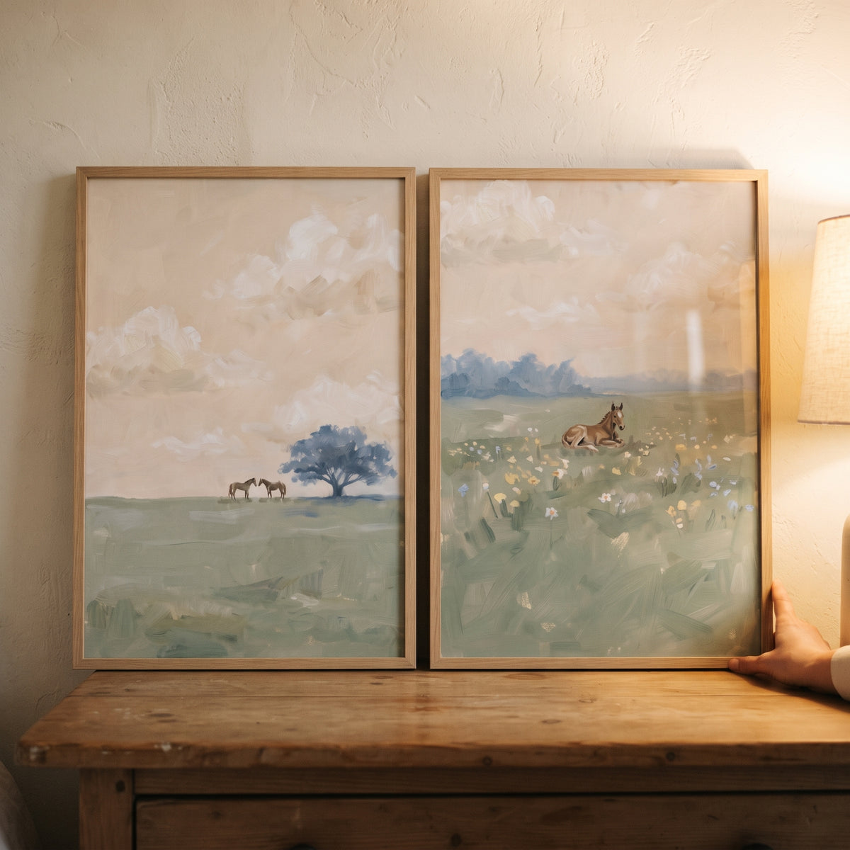 Warm beige field horse wall art set of 2 in wood frames, featuring horses in soft meadows under a cloudy sky.