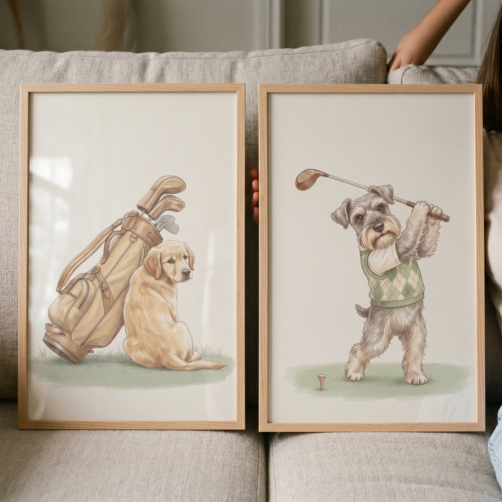 Warm cream golfing dogs wall art set of 2 with a golden retriever next to a golf bag and a schnauzer swinging a club.