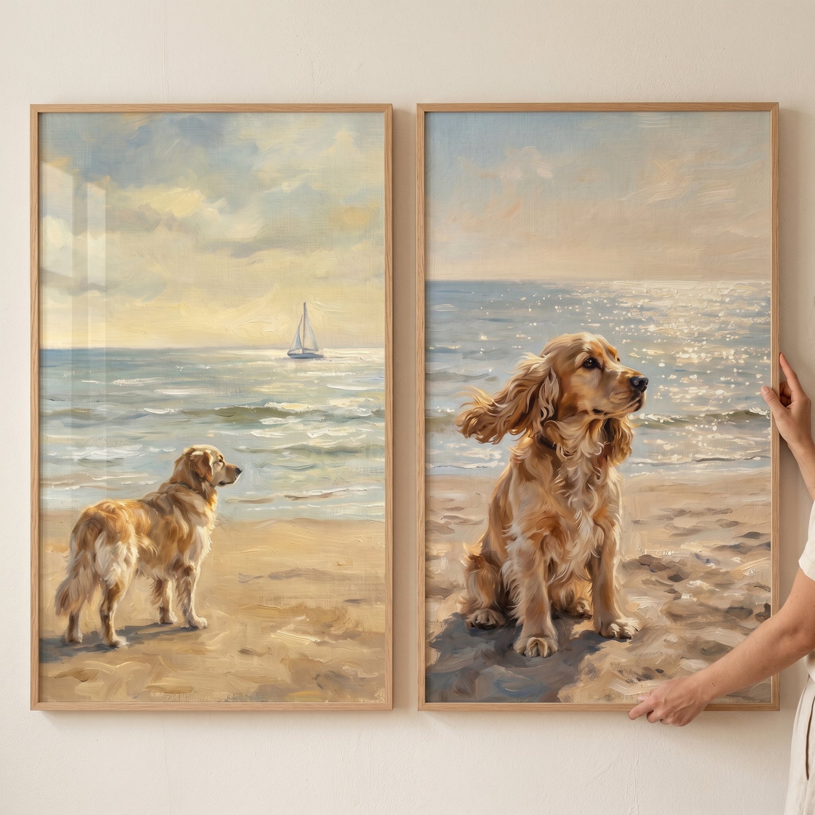 Warm glow beach dog wall art set of 2 featuring two dogs on a sunny shore with a distant sailboat and shimmering waves.