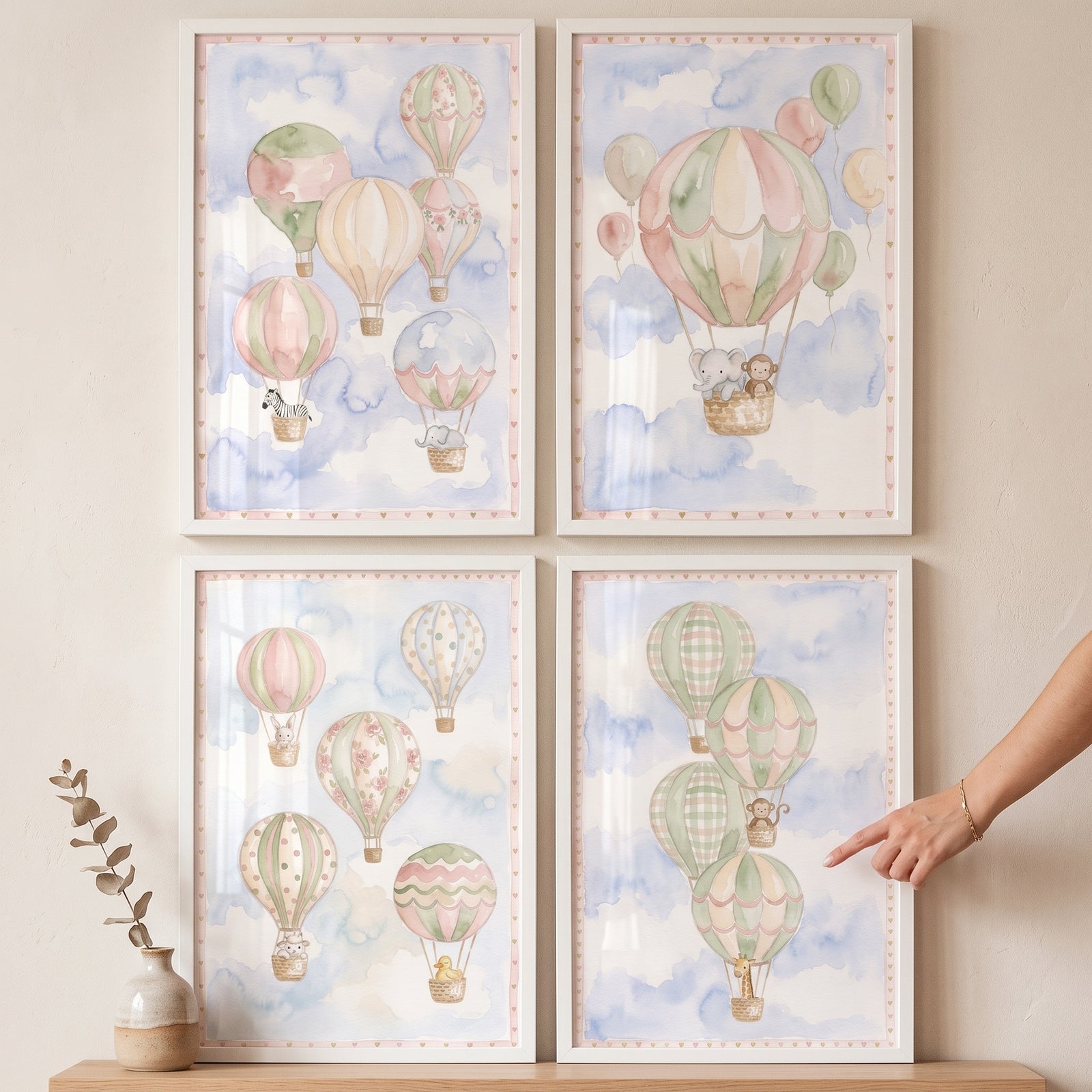 Watercolor animal hot air balloon print set of 4 in white frames featuring safari animals floating in a soft blue sky.