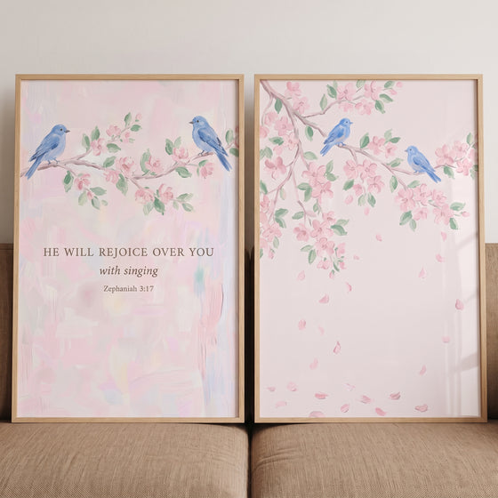 Watercolor azure blue bird wall art set of 2 features birds on pink blossom branches with scripture and falling petals.