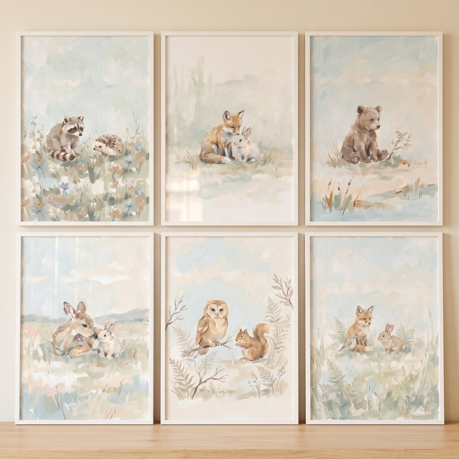 Watercolor baby woodland animals wall art set of 6 with a bear, fox, deer, owl, raccoon, squirrel, rabbits, and hedgehog.