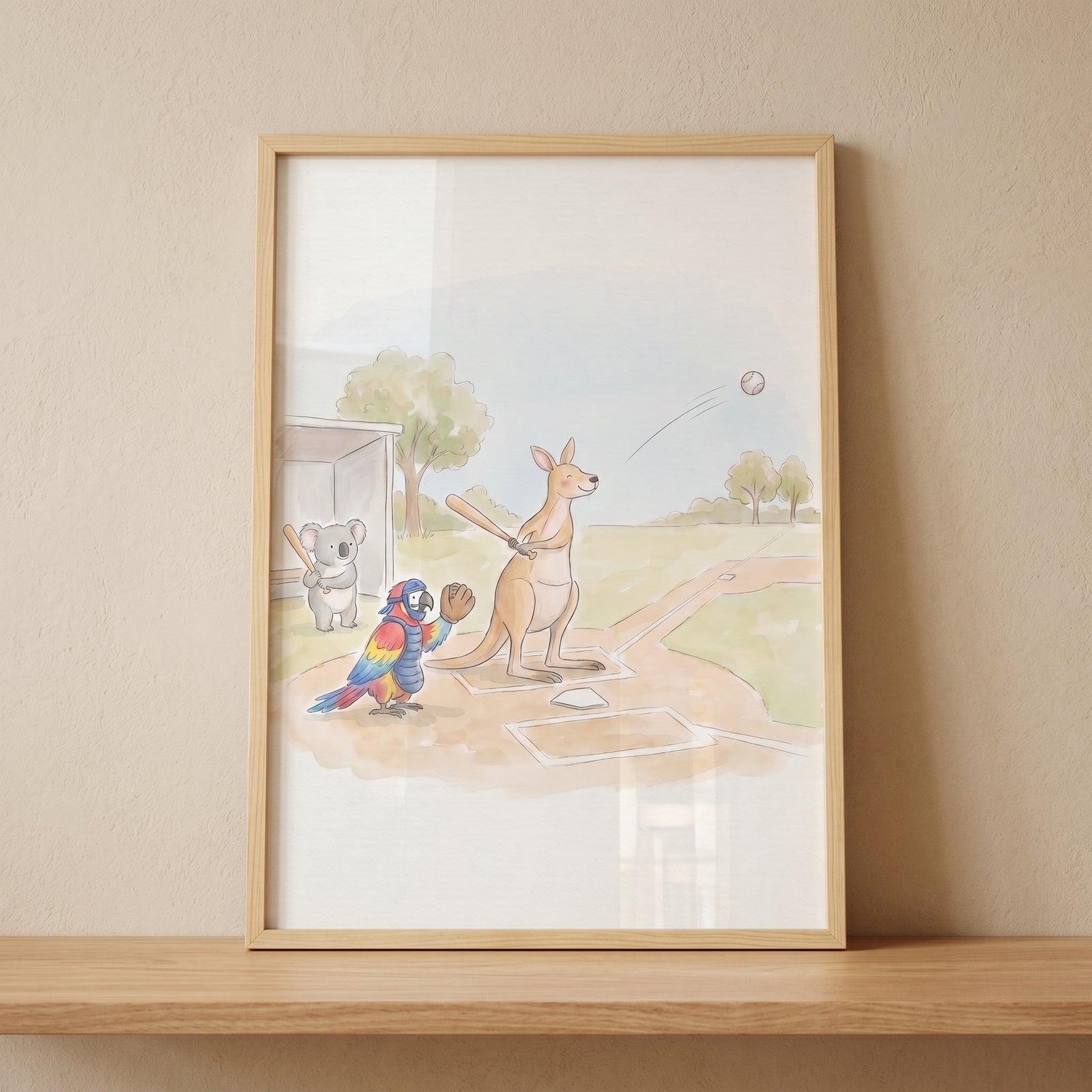 Kangaroo, parrot, and koala play ball in this framed watercolor baseball animals wall art on a shelf.
