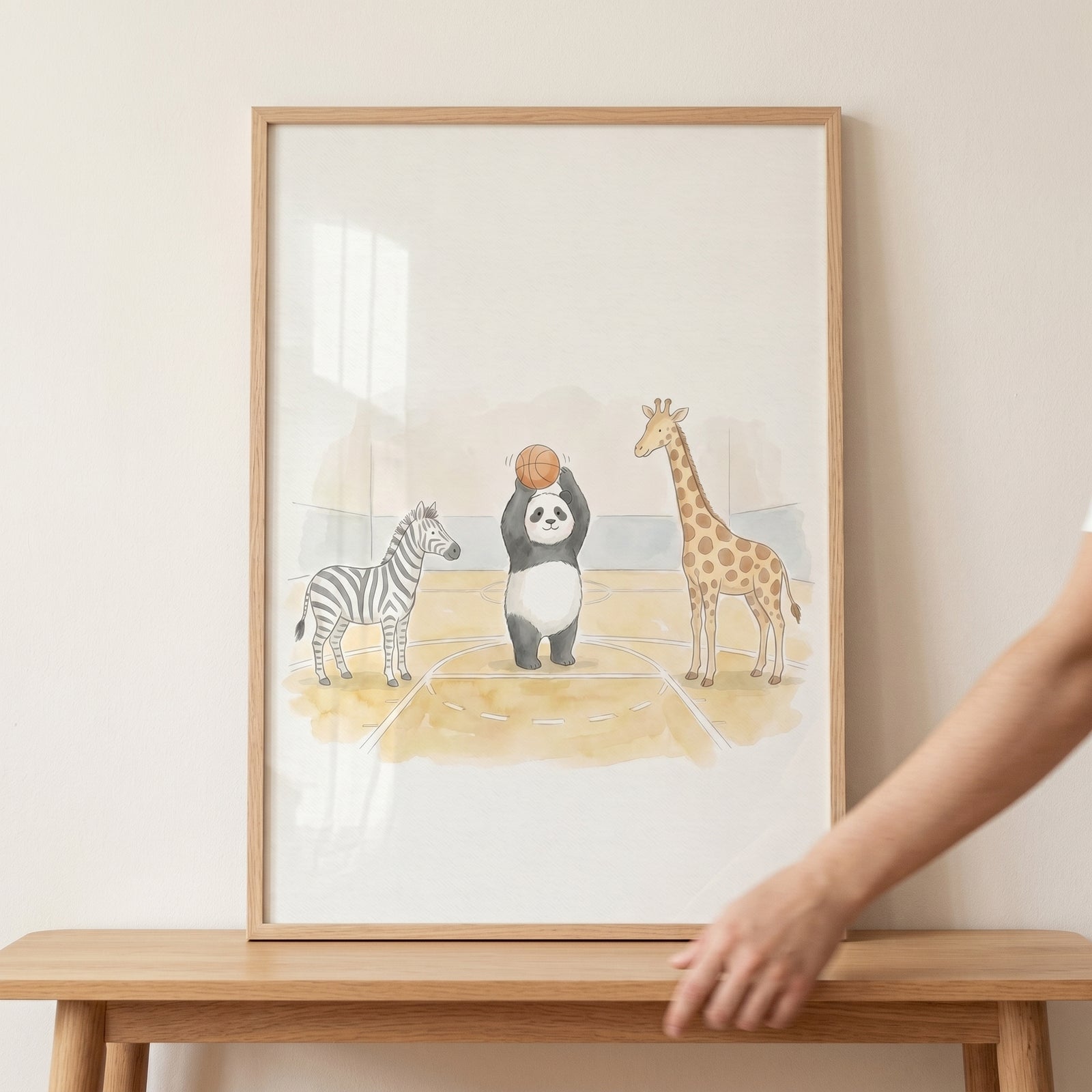 Framed watercolor basketball animals wall art features a panda, zebra, and giraffe on a court.