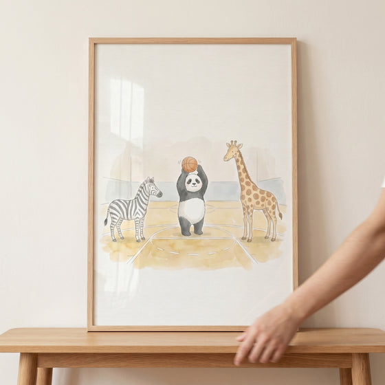 Framed watercolor basketball animals wall art features a panda, zebra, and giraffe on a court.