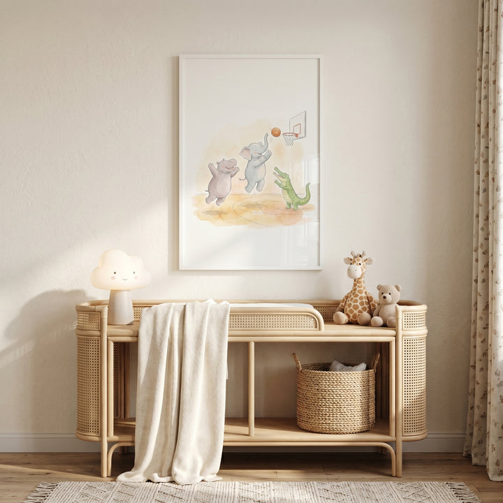 Watercolor basketball safari animals wall art hangs above a rattan changing table with a cloud lamp and stuffed animals.