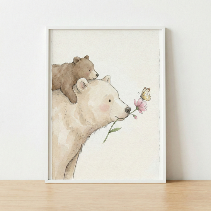A whimsical watercolor-style illustration features two bears. A large, cream-colored bear holds a pink flower by its stem in its mouth. A smaller brown bear cub rests comfortably on the larger bear's back. A delicate yellow butterfly is near the pink flower. The artwork is showcased in a slim white frame, which sits on a light-colored wooden surface against a plain white wall.