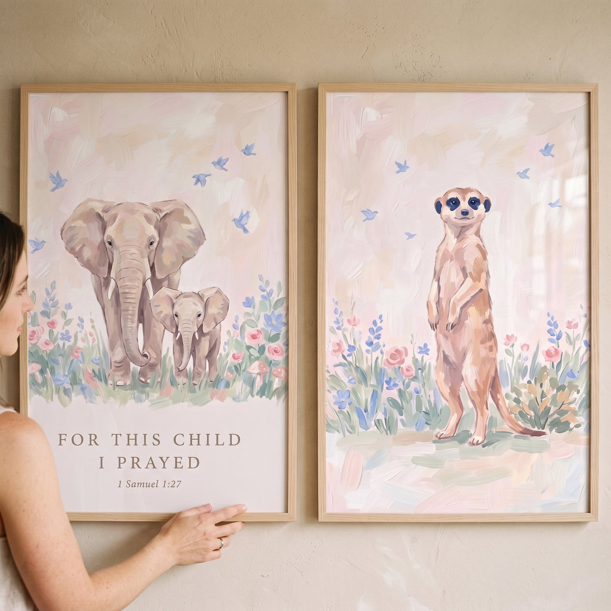 Watercolor bloom safari animals wall art set of 2 featuring an elephant family with a bible verse and a standing meerkat.