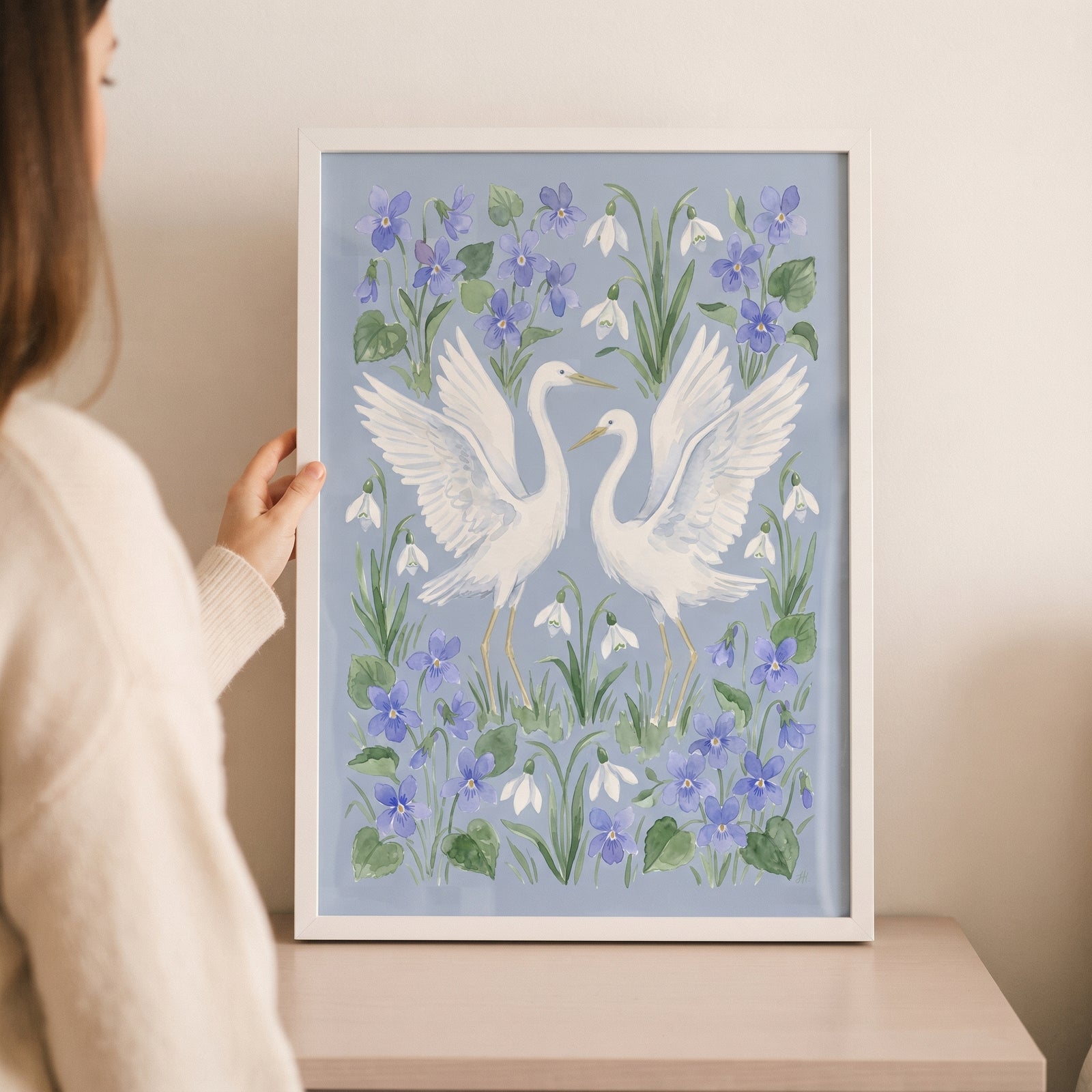 Framed watercolor blue white egret bird wall art featuring two birds among purple violets and white snowdrop flowers.