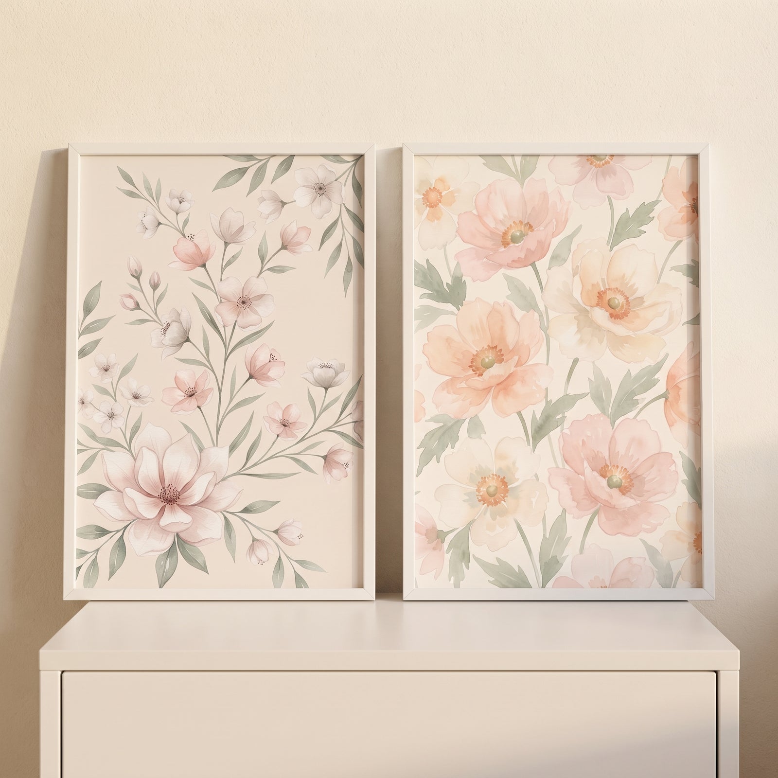 Framed watercolor botanical pink floral wall art set of 2 resting on a white dresser.