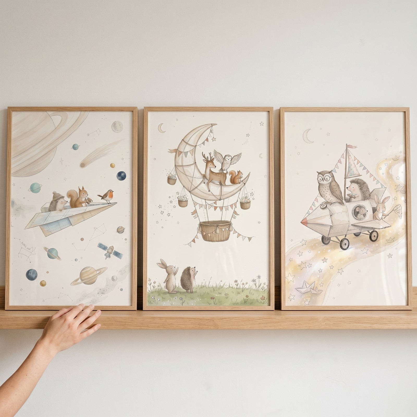 Watercolor celestial adventure animals wall art set of 3 on a shelf featuring woodland creatures traveling in space.