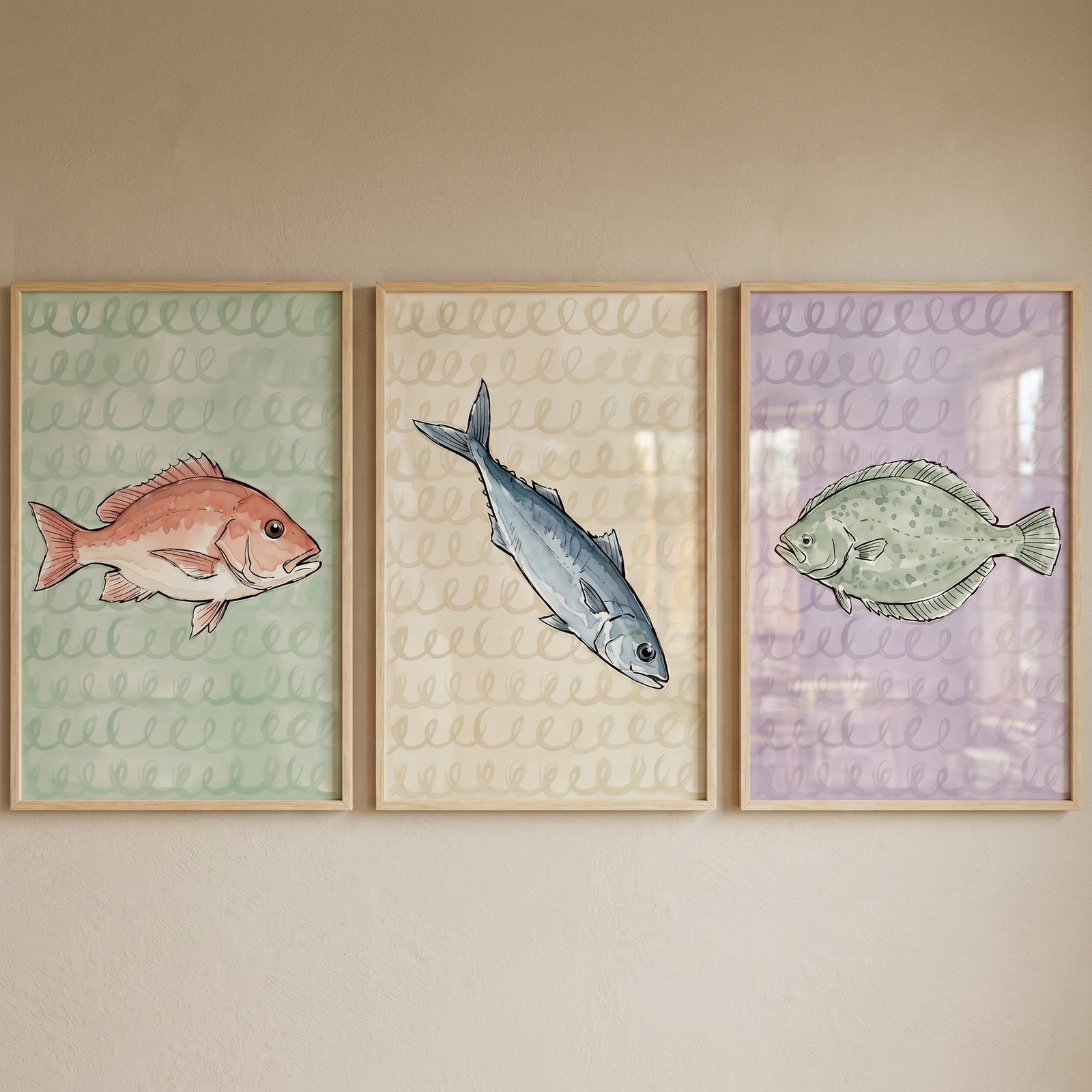 Watercolor coastal marine fish wall art set of 3 features a red snapper, mackerel, and flatfish in wood frames.