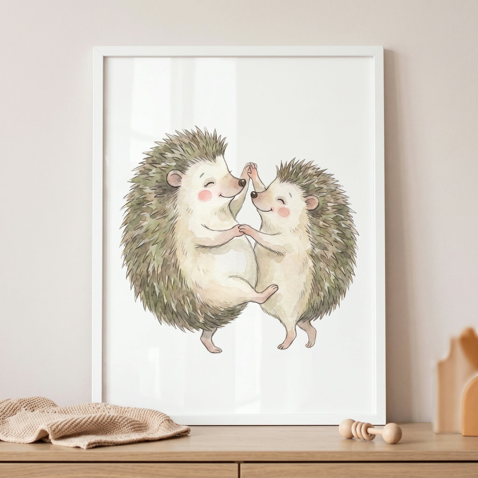 Watercolor dancing hedgehog wall art features two smiling hedgehogs holding hands and dancing in a white frame.