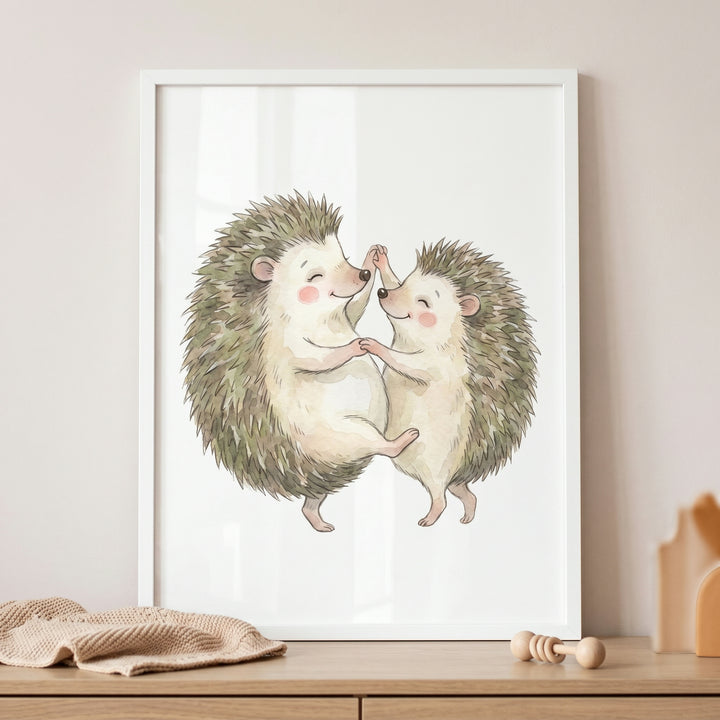 Watercolor dancing hedgehog wall art features two smiling hedgehogs holding hands and dancing in a white frame.