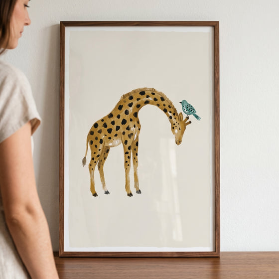 Watercolor earth tone giraffe wall art featuring a giraffe with a small teal bird perched on its head.