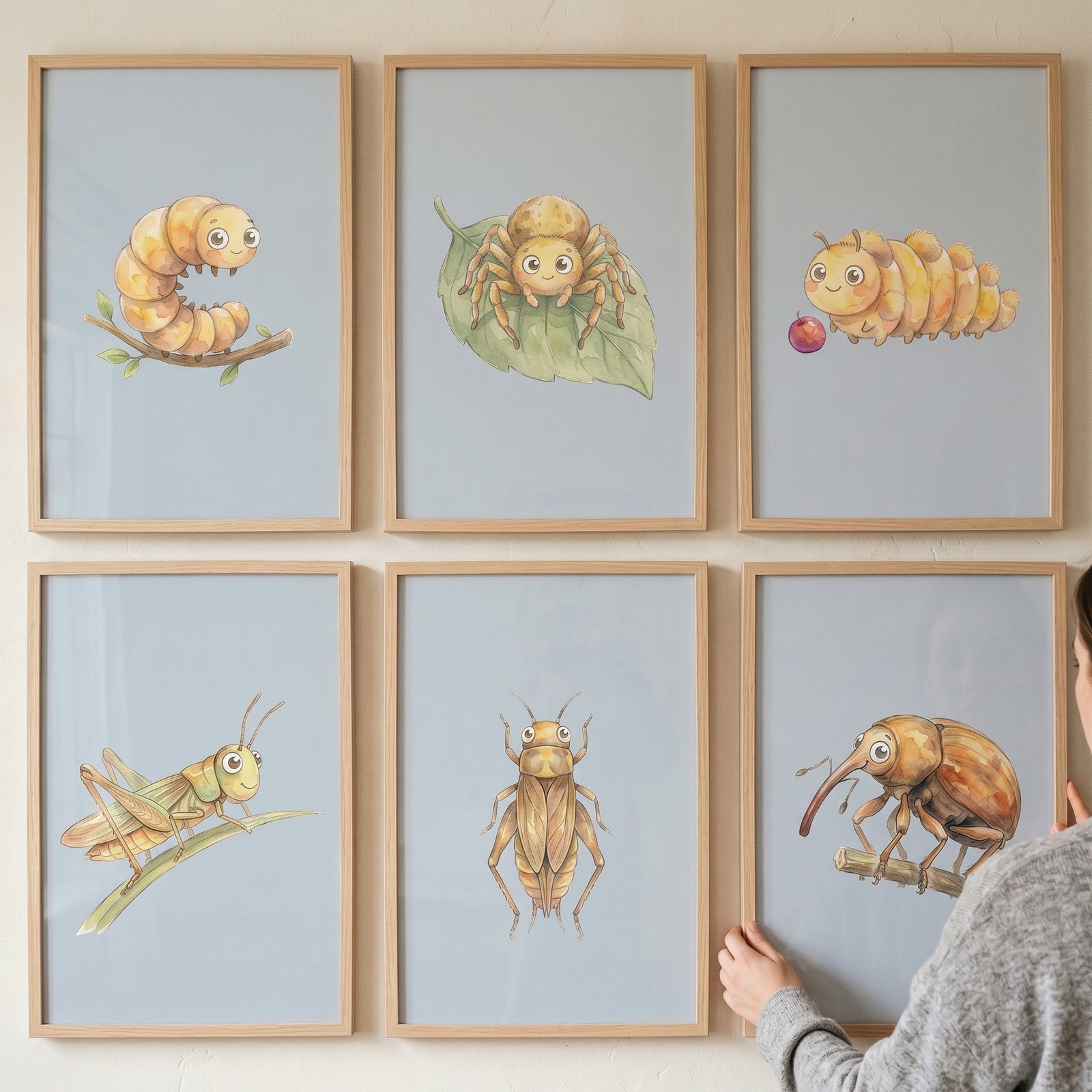 Watercolor earthy garden insect wall art set of 6 featuring cute cartoon bugs in wooden frames on a wall.