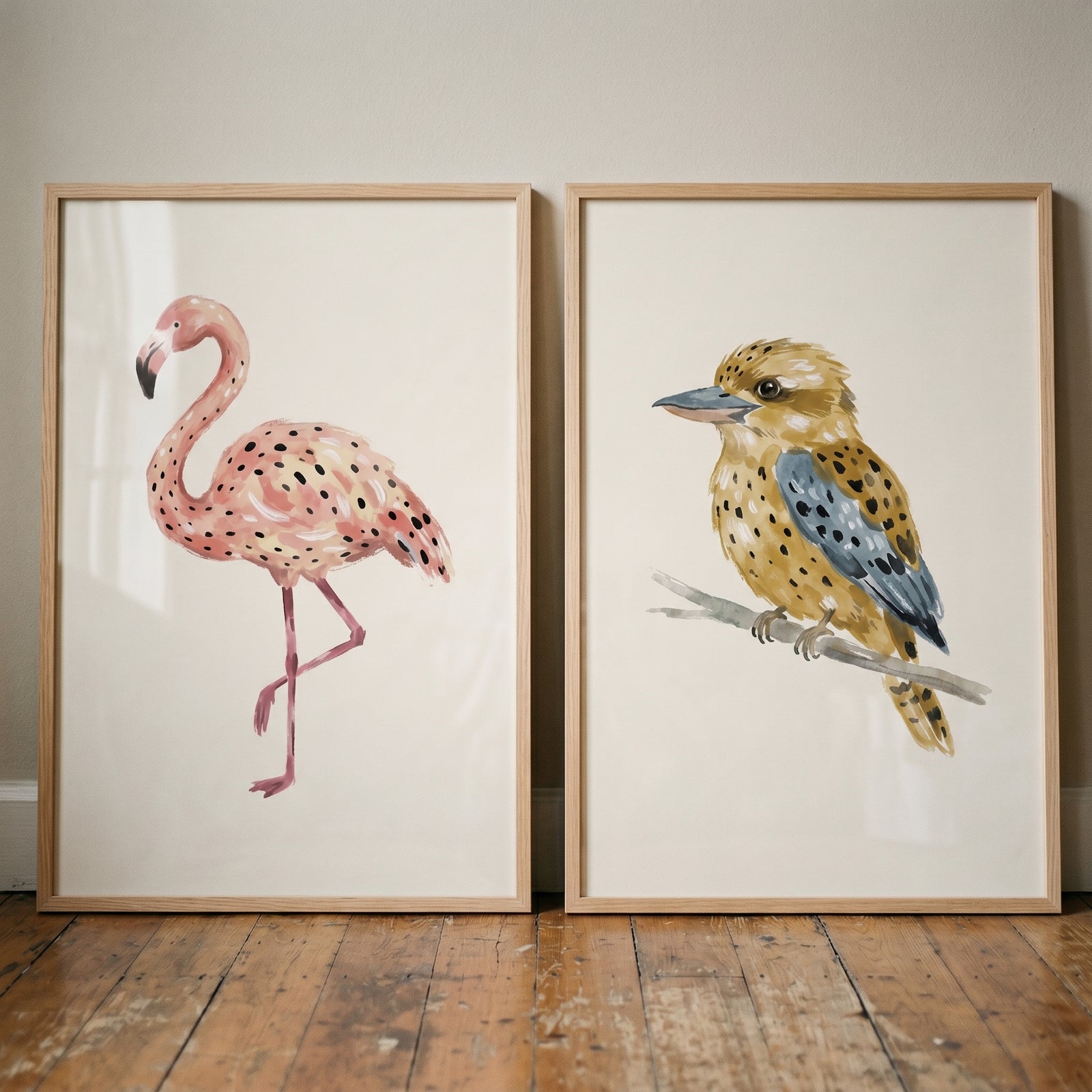 Watercolor earthy spotted birds wall art set of 2 featuring a pink flamingo and a perched bird in light wood frames.