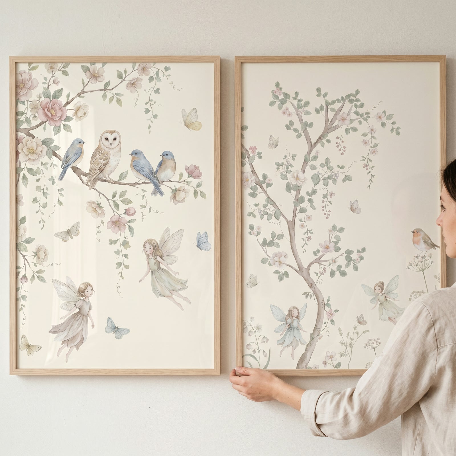 Watercolor enchanted garden fairies wall art set of 2 featuring birds and tiny winged figures in light wood frames.