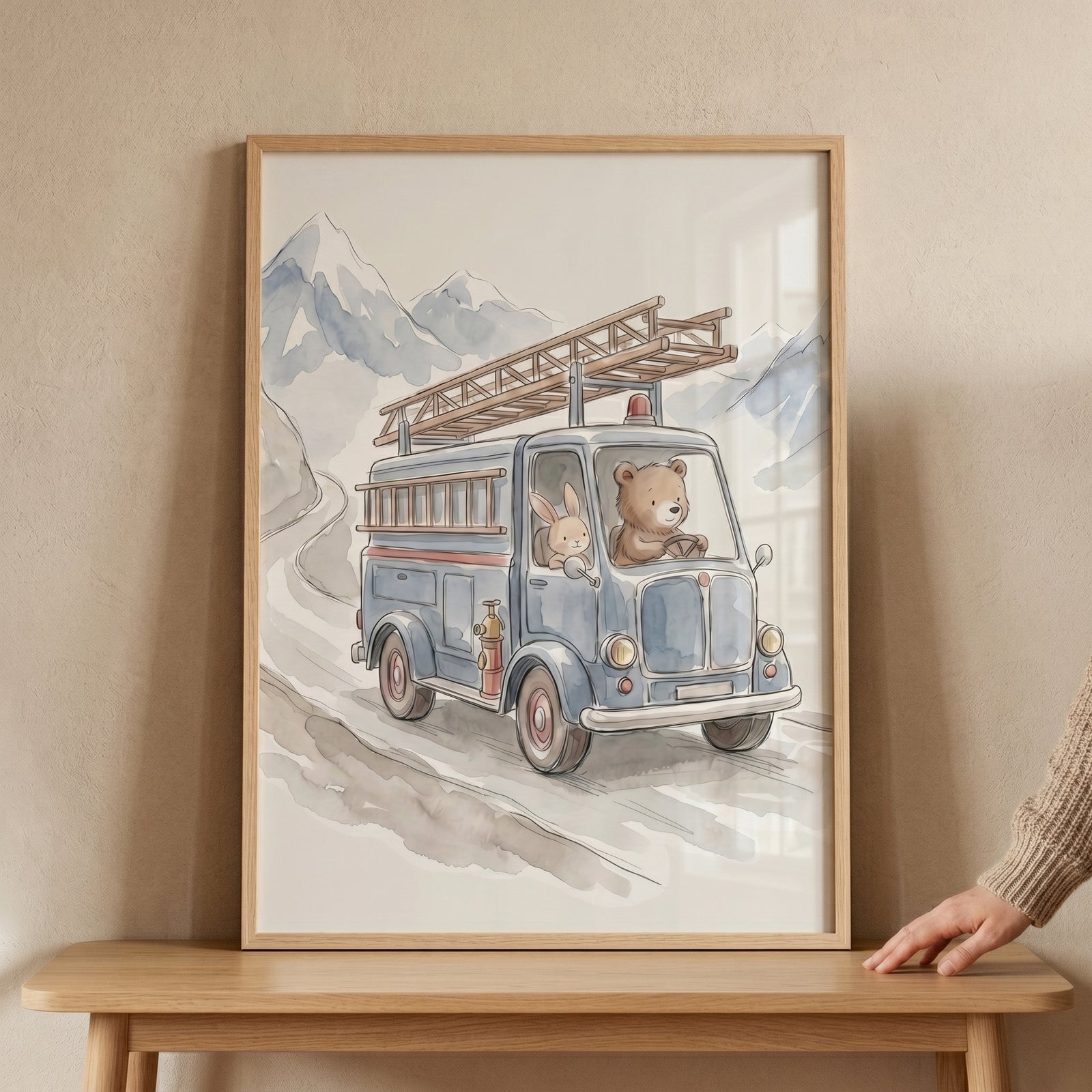 Watercolor fire truck animals wall art of a bear and bunny driving a blue truck along a winding mountain road.