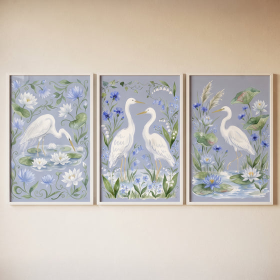 Watercolor floral egret bird wall art set of 3 featuring white herons and lotus flowers in a soft botanical landscape.