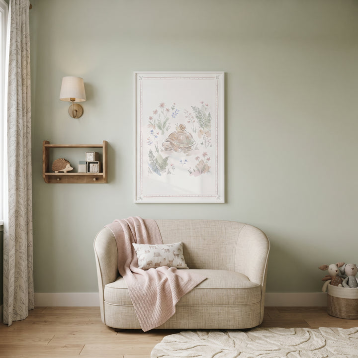 Watercolor floral garden turtle wall art above a cream loveseat with a pink throw in a serene sage green nursery.