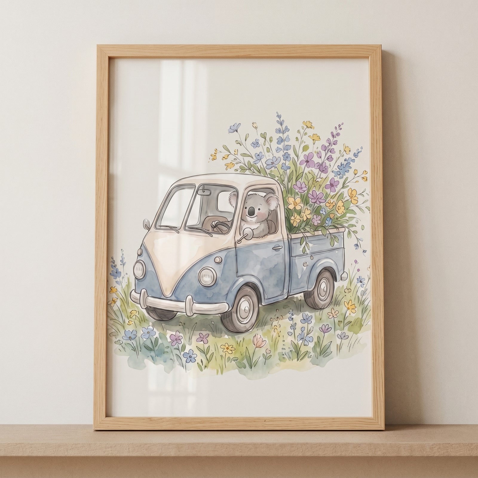 Framed watercolor floral truck koala wall art depicts a koala driving a blue vintage truck filled with flowers.