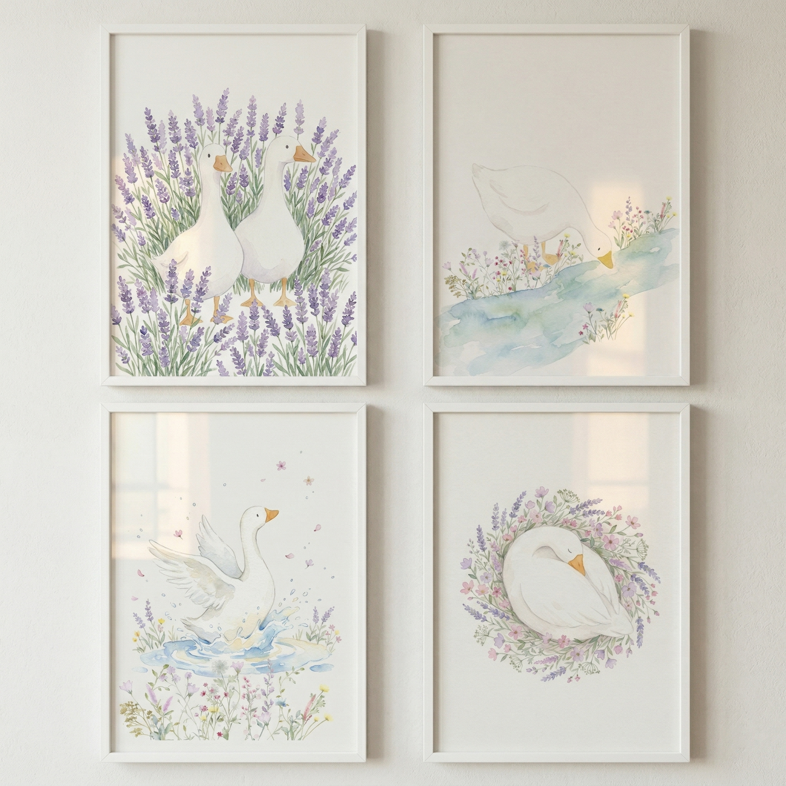 Four framed watercolor illustrations arranged in a grid show white ducks in soft nature scenes including standing among lavender drinking from a stream splashing in water and resting in a floral wreath. The pastel colors and gentle details create a cohesive calm nursery wall display.