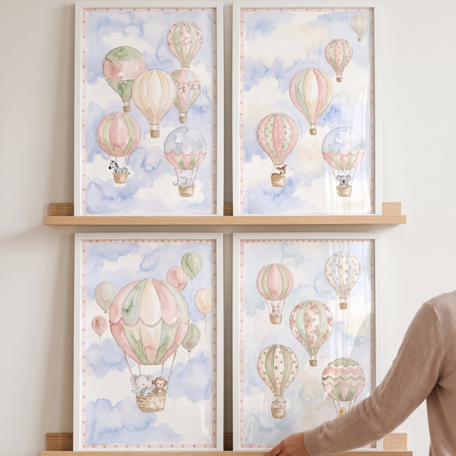 Watercolor flying baby animal wall art set of 4 on wooden shelves featuring hot air balloons and clouds in a blue sky.