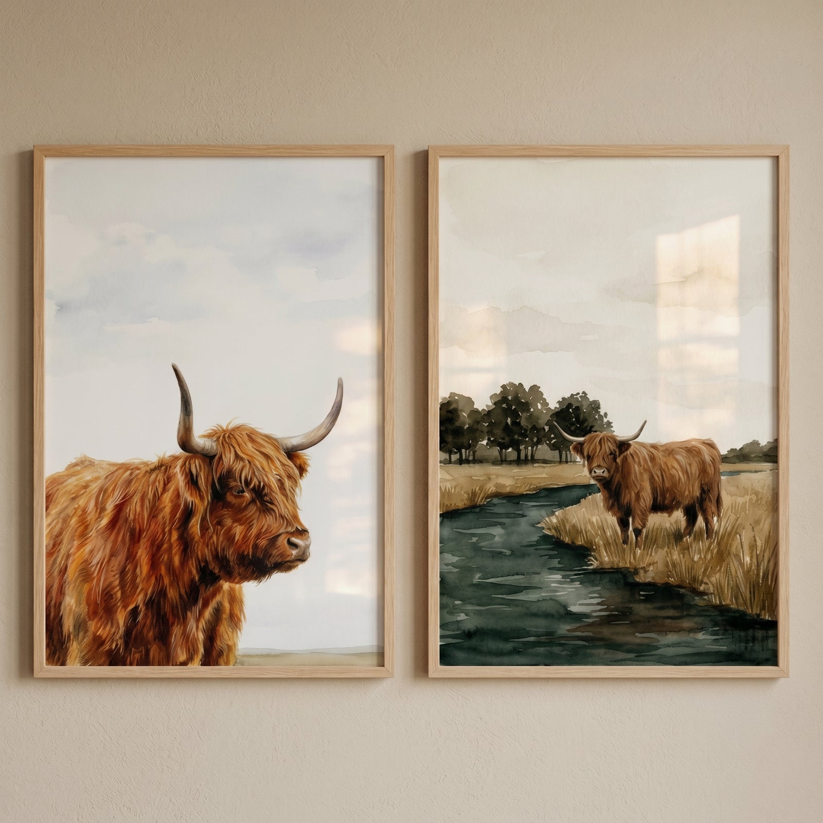 Watercolor ginger highland cow wall art set of 2 featuring a close-up and a stream landscape in light wood frames.