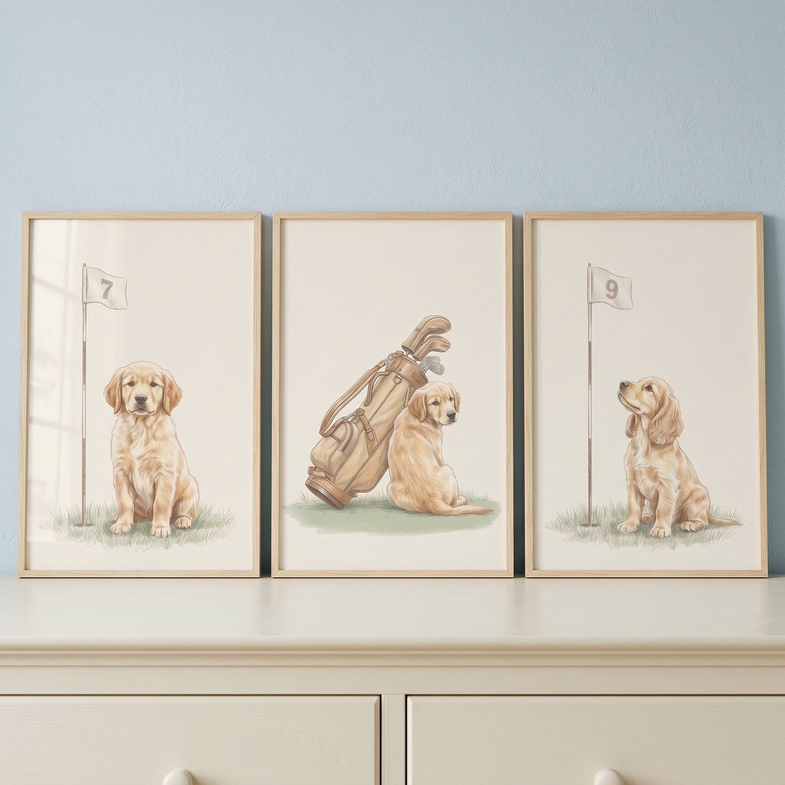 Watercolor golfing golden retriever wall art set of 3 features puppies with golf flags and a bag in wood frames.