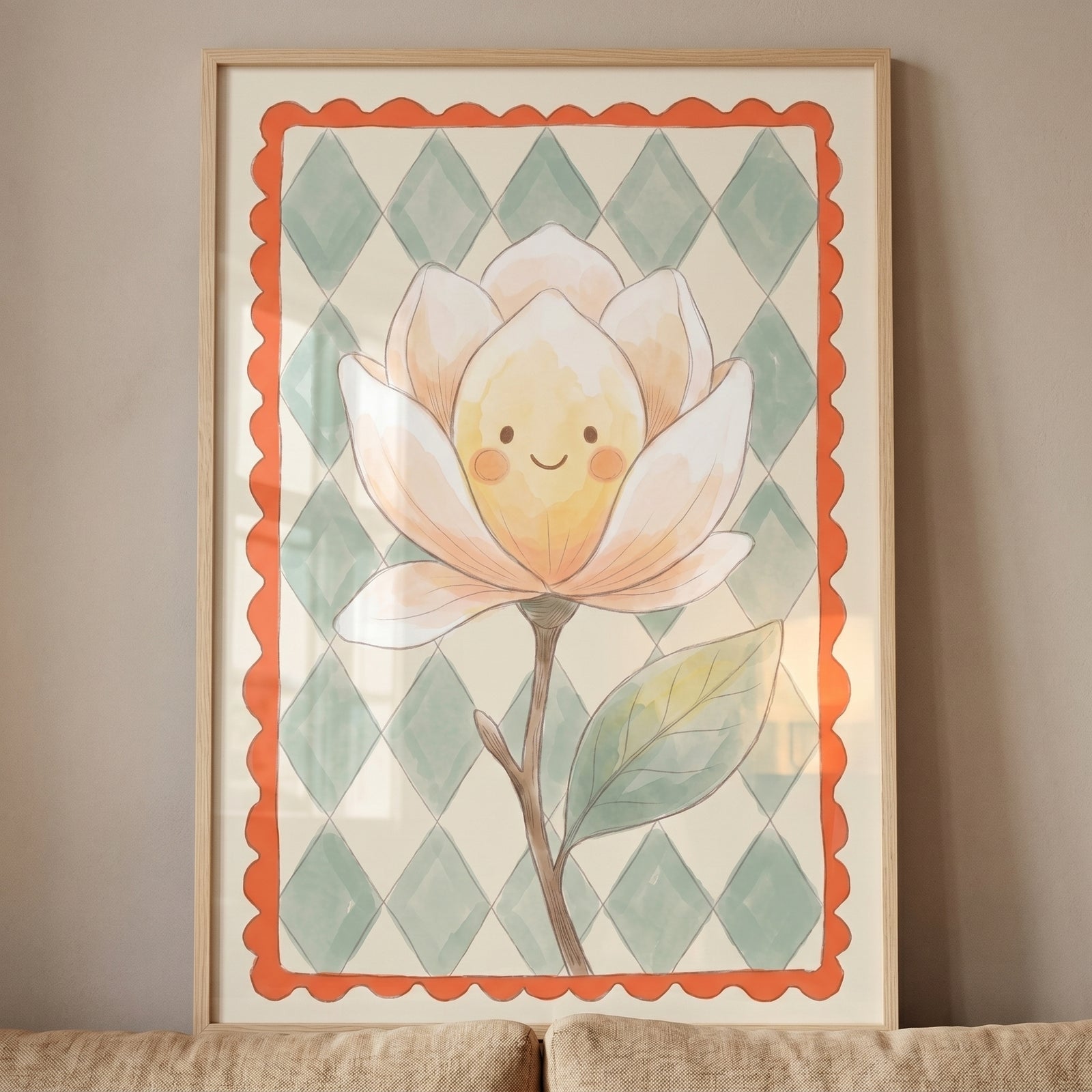Framed watercolor happy face magnolia flower wall art with a green diamond background and orange scalloped border.