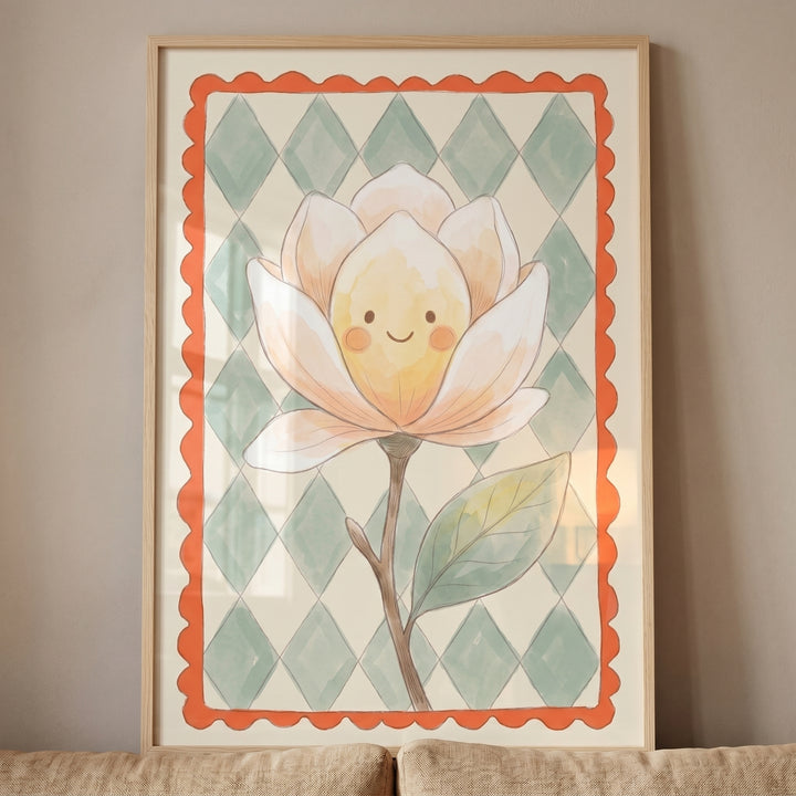 Framed watercolor happy face magnolia flower wall art with a green diamond background and orange scalloped border.