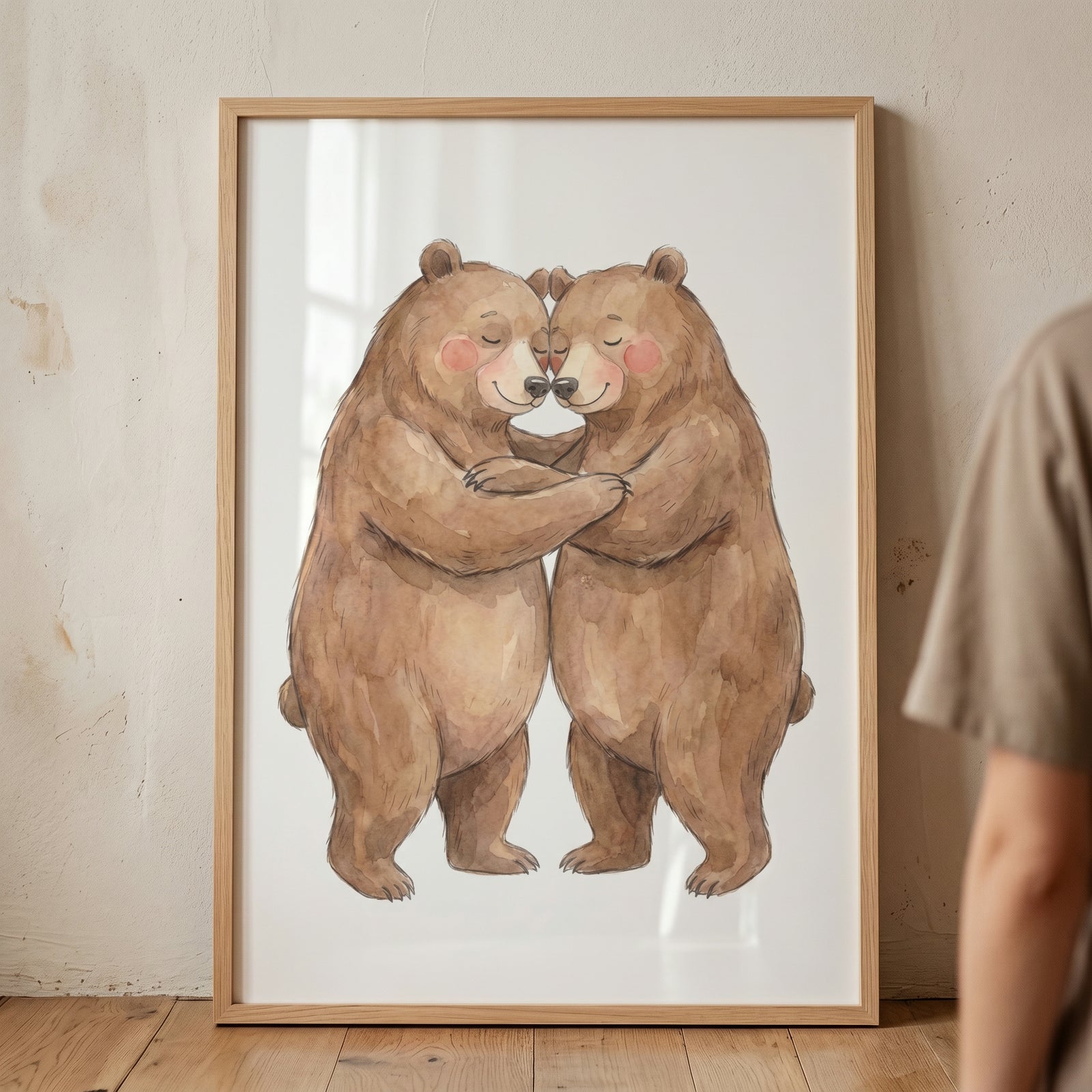 Framed watercolor hugging brown bear wall art shows two bears with pink cheeks embracing on a white background.