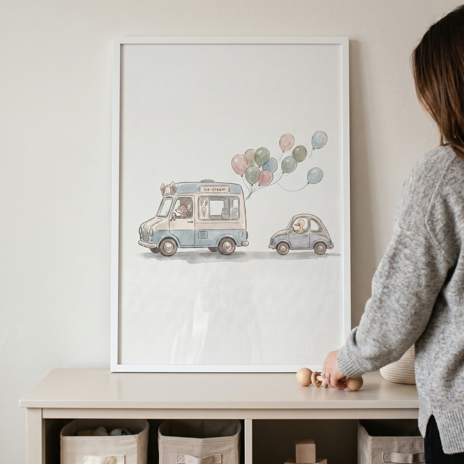 Framed watercolor ice cream truck wall art shows animals driving vehicles with colorful balloons above a storage unit.
