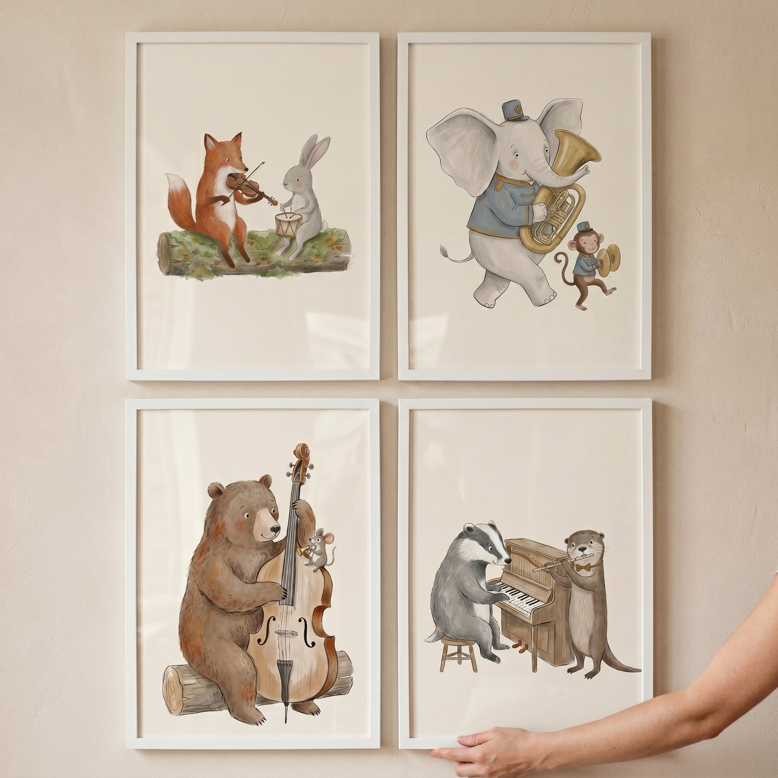 Watercolor instrument playing animals wall art set of 4 features musical animals in white frames on a neutral wall.