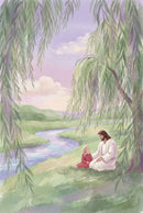 Soft watercolor illustration of Jesus sitting on the grass beside a young girl under long flowing willow branches near a winding river. Gentle hills and pastel clouds fill the background. The quiet riverside setting conveys peace and companionship.

