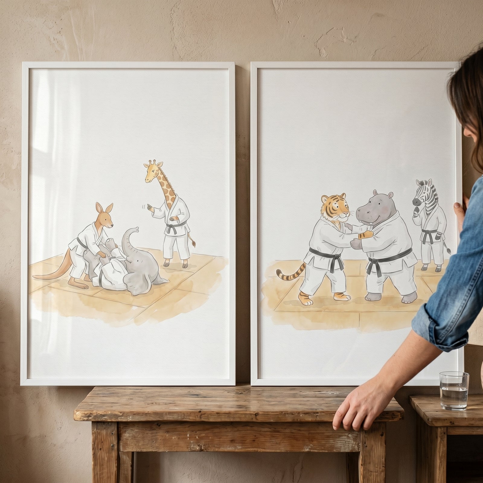 Watercolor karate wild animals wall art set of 2 in frames showing a giraffe, tiger, and hippo in martial arts attire.