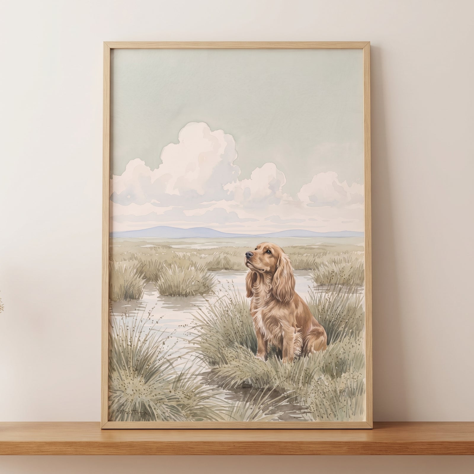 Watercolor marsh cocker spaniel dog wall art featuring a golden dog in tall grass under big fluffy clouds.