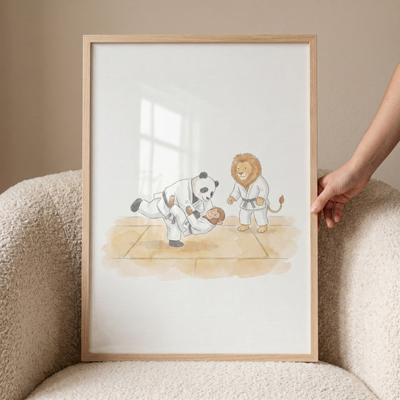 Framed watercolor martial arts animals wall art depicts a panda, monkey, and lion practicing on a mat.