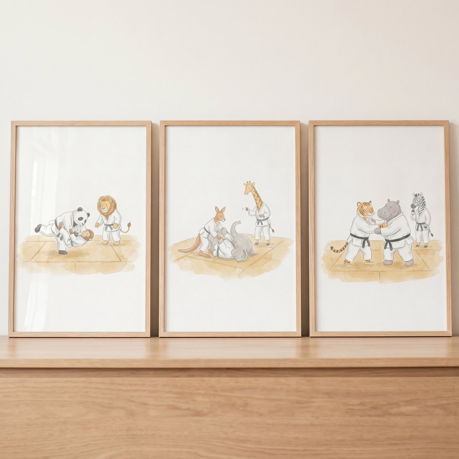 Watercolor martial arts animals wall art set of 3 depicts zoo animals in white uniforms practicing judo.