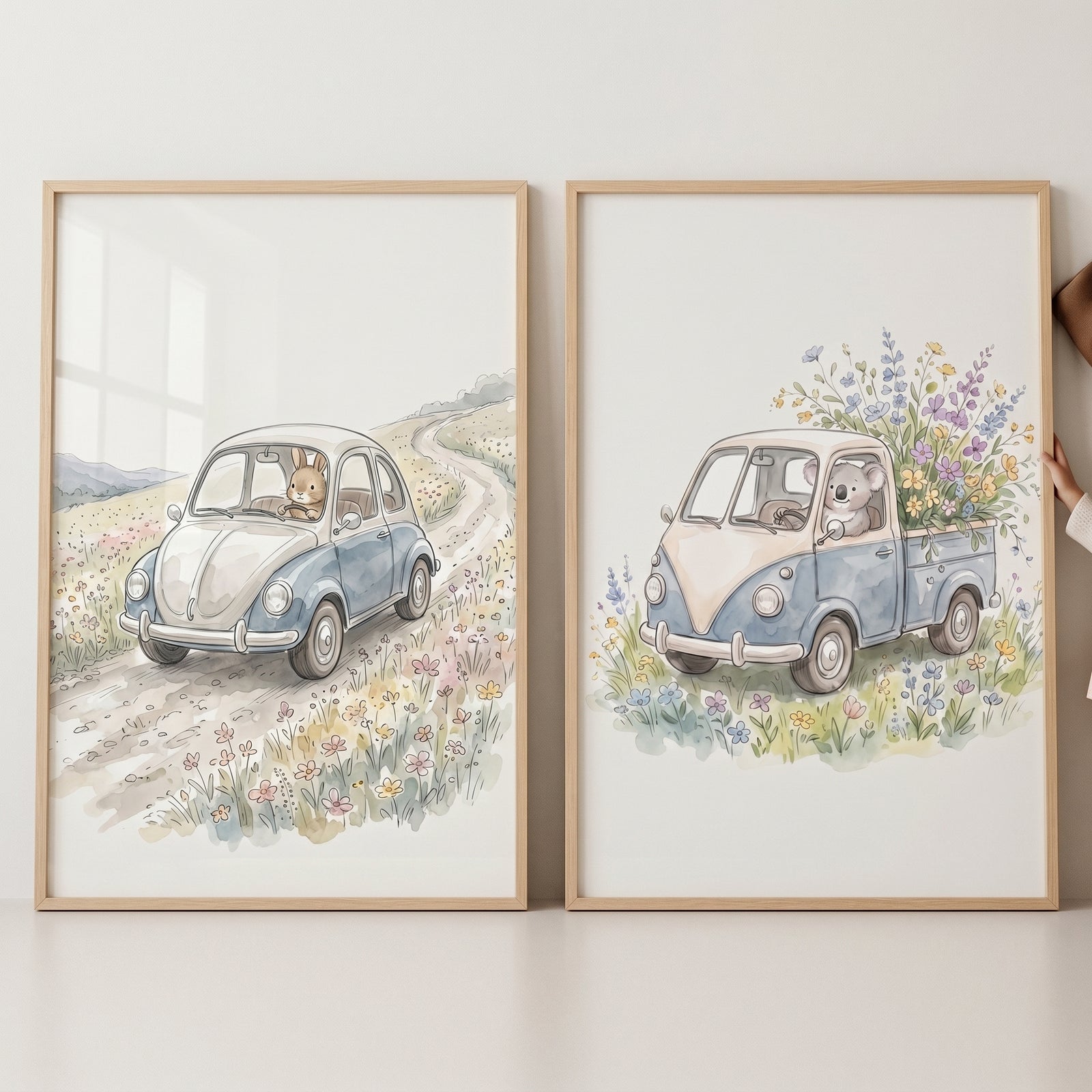 Watercolor meadow driving animals wall art set of 2 featuring a rabbit in a car and a koala in a flower-filled truck.