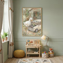 A charming children's room with soft green walls features a large framed watercolor illustration as a centerpiece. The illustration portrays a whimsical scene of a white goose and a tiny frog peering into the engine of a small, vintage-style cream car, set against a backdrop of a weathered wooden barn and a flower-filled garden. 
